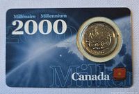 Front of Millennium display card with 2000 Canada 25-cent coin