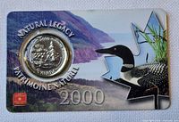 Front of display card showing inserted loon coin and printed 2000 Natural Legacy artwork