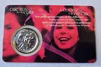 Front view of sealed presentation card containing the 2000 CIBC Run for the Cure 25-cent coin