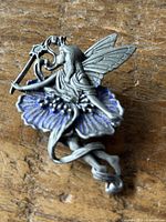 Front view of fairy brooch showing design details