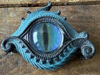Top view of dragon eye trinket box showing glass eye and textured lid