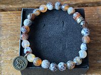 Top view of full bracelet on display box