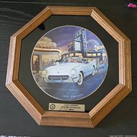 Framed octagonal wood frame with ceramic plate showing 1953 Corvette, gold-tone plaque visible