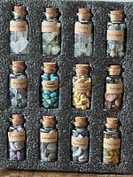 Full set of 12 labelled gemstone bottles in foam insert