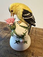 Overall view of bell, bird, and thistle detail