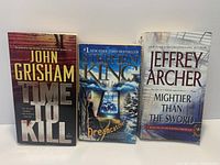 Front covers of all three paperback novels
