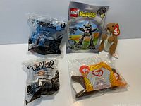 All five packaged toys displayed