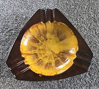 Top view of triangular Blue Mountain Pottery ashtray showing glaze colors and three rests