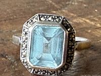 Top view of ring showing blue gemstone and marcasite border