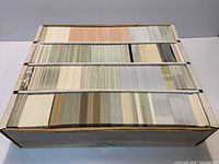 Four-row cardboard box filled with thousands of hockey cards