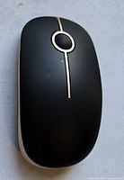 Top view of black MS001 wireless mouse showing design