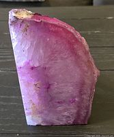Front view showing polished face, pink banded quartz layers