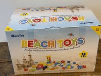 Front of sealed iBaseToy Beach Toys box showing product name and graphics