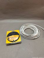 Overall view showing packaged lamp wire and coil of white 14/2 cable