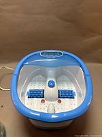 Foot spa top view showing basin and rollers