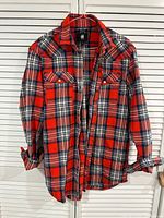 Front view of G-Star RAW red plaid flannel shirt hanging