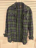 Front view of blue/green plaid G-Star RAW shirt hanging
