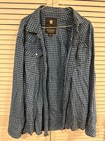 Full view of blue check G-Star RAW long-sleeve shirt on hanger