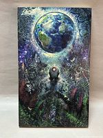 Front of wood panel showing Earth and cosmic print
