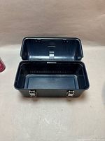 Lunch box interior showing single compartment and lid hinges