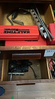 Drawer with Half-Time cases, hand brace, auger bits, corded jigsaw