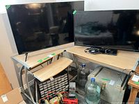 Full view showing L-shaped desk with light wood top and metal legs