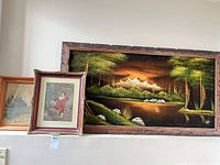 Three of the framed artworks: large oil on velvet mountain landscape, Boy in Red print, small oil on board