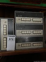 Four stacked HP 58307A VHF switch front panels with push buttons visible
