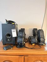 Full set showing subwoofer, four of the satellites and control pod