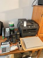 Overview with printer, phone system, monitor, calculator, CD spindles