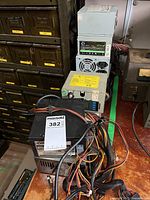 Front view showing Orion ATX power supply and two grey industrial units behind