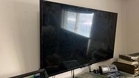 Front view of Sony Bravia 40" smart TV mounted on wall