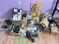 Assorted boxes and bins with modules, sensors, junction box and wiring