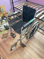 Overall view of wheelchair folded out