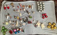 Full layout of all assorted Christmas ornaments on blanket