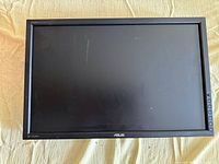 Front view of ASUS PA248Q monitor with black bezel and control buttons