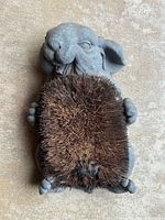 Front view of cast iron rabbit boot brush