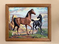 Front view of the framed horse landscape artwork