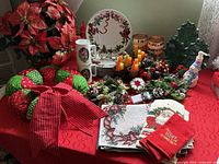 Overview of entire Christmas décor assortment on red table covering