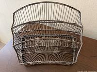 Front view of 3-tier metal wire mail organizer showing twisted wire design and three compartments