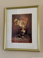 Full view of framed floral still life print with mat and gold-tone frame