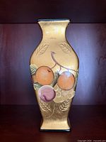 Front view showing fruit motif and gold foil finish