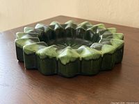 Angled view showing starburst rim and glaze coloration