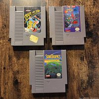 All three NES cartridges arranged on table