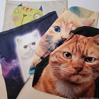 Four cat pillow covers layered for overview