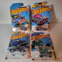 Group shot of four sealed Hot Wheels cars