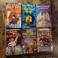 Six fantasy paperbacks laid out, front covers visible