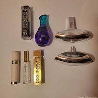 All five perfume bottles displayed together