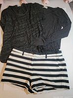 Full view of the three clothing items laid flat