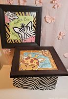 Both framed prints and storage box displayed together